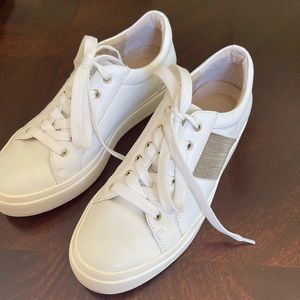 Vaneli sport sneakers with gold and silver on one side.